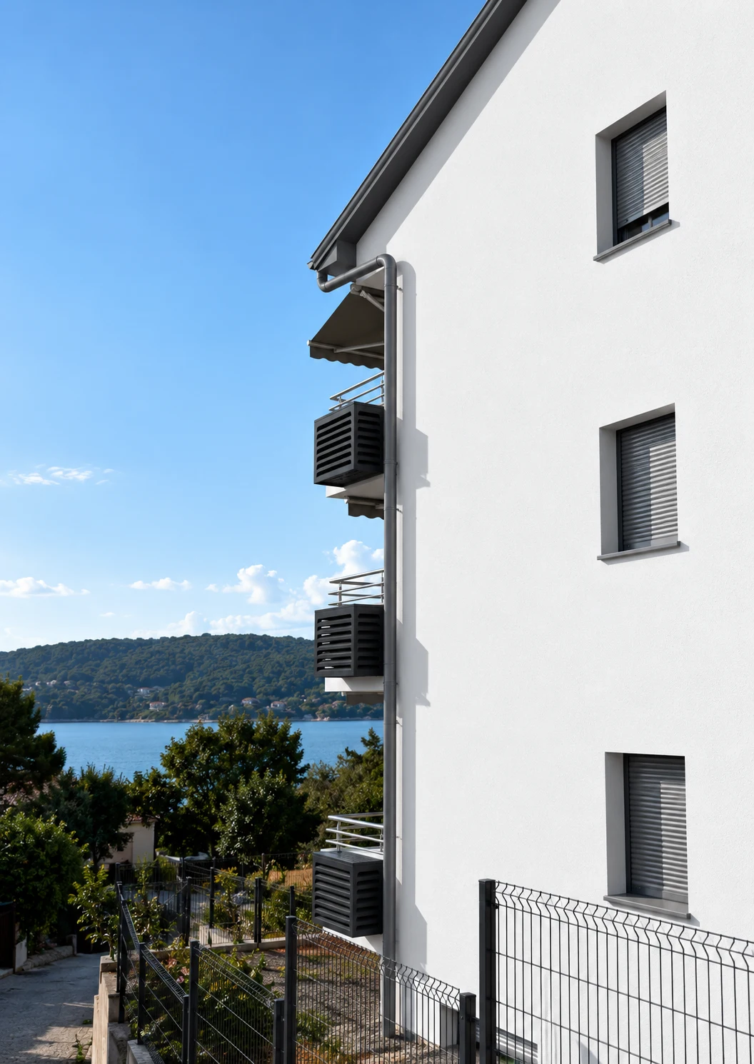 Three Matro covers aligned on balcony brackets along a white facade above the water